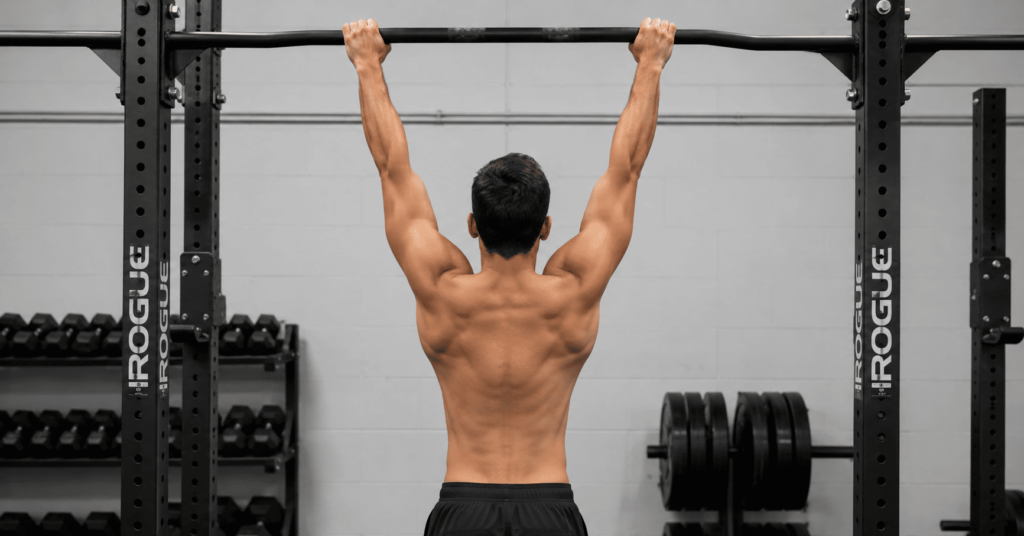 Active dead hang on pull-up bar for forearm and grip tendon strength
