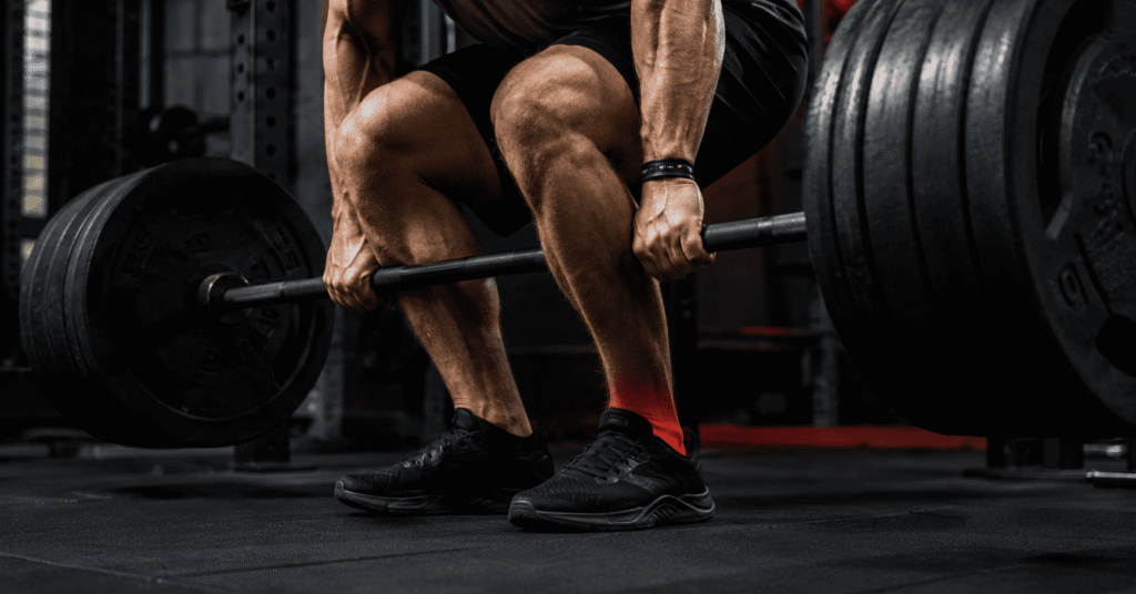 Strong athlete deadlifting with weak tendon injury risk